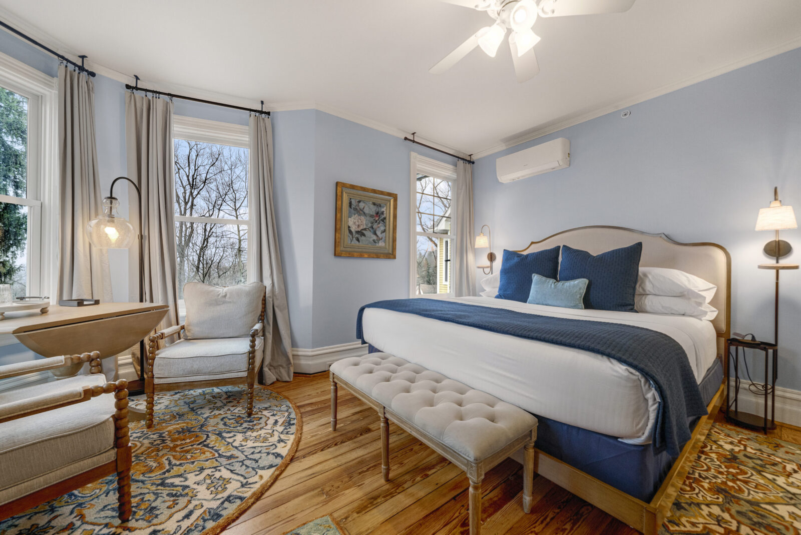 Mountainview Room with King bed dressed in blue linens.