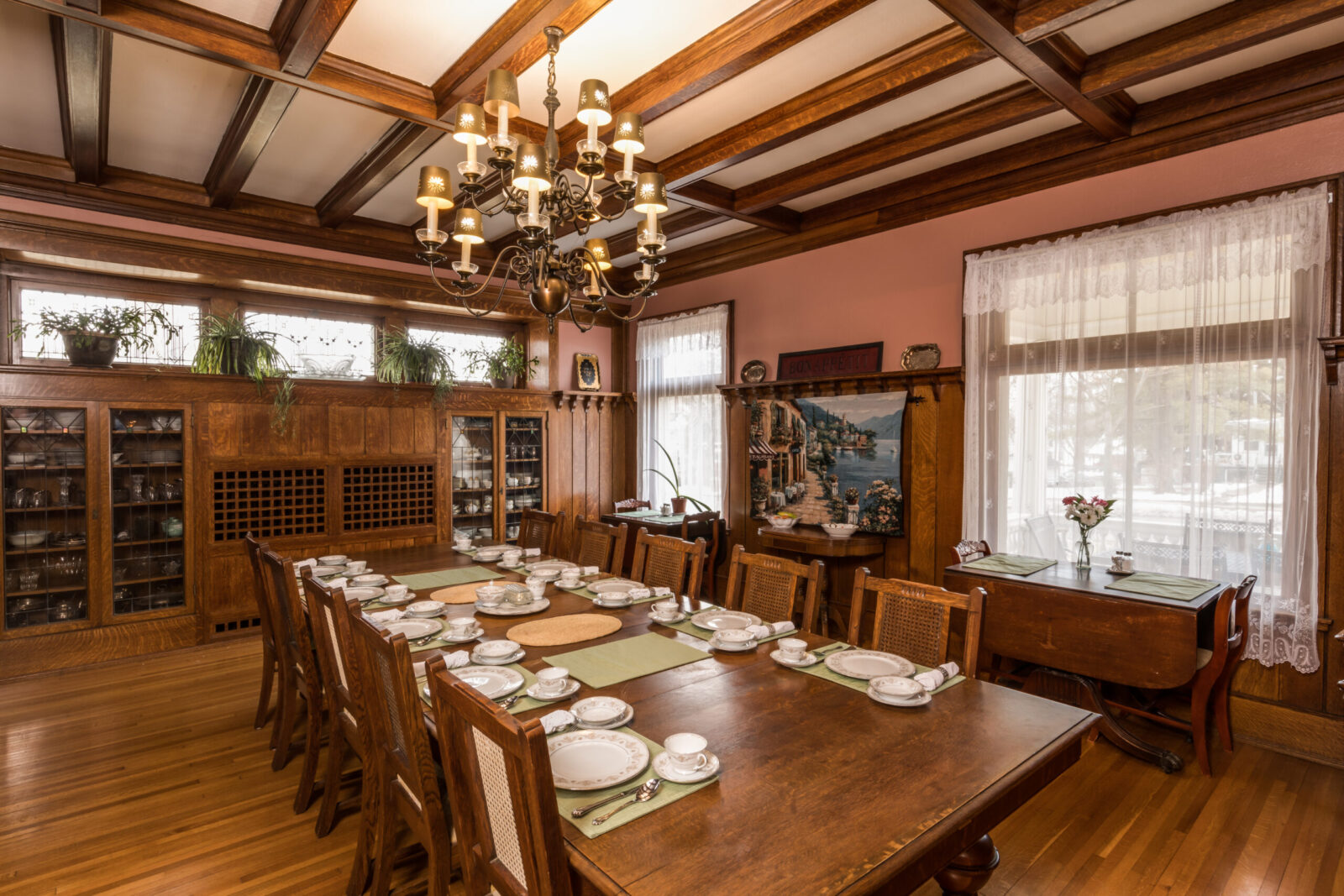 The dining room features the Ringling family's dining table, set here for breakfast service.