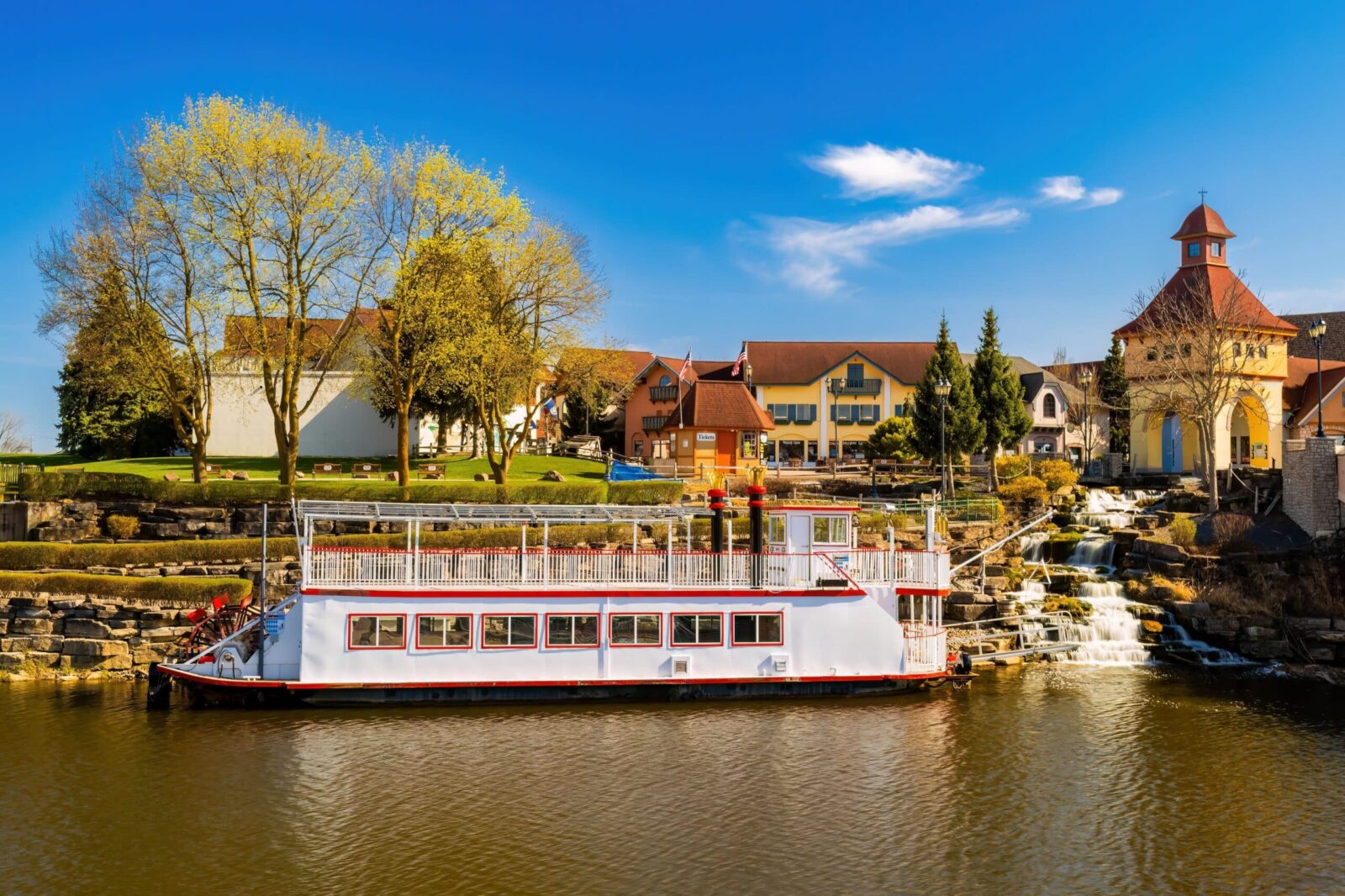 The Bavarian Belle sits at the Riverplace Shops on the Cass River. Riding the riverboat is one of the top things to do in Frankenmuth.