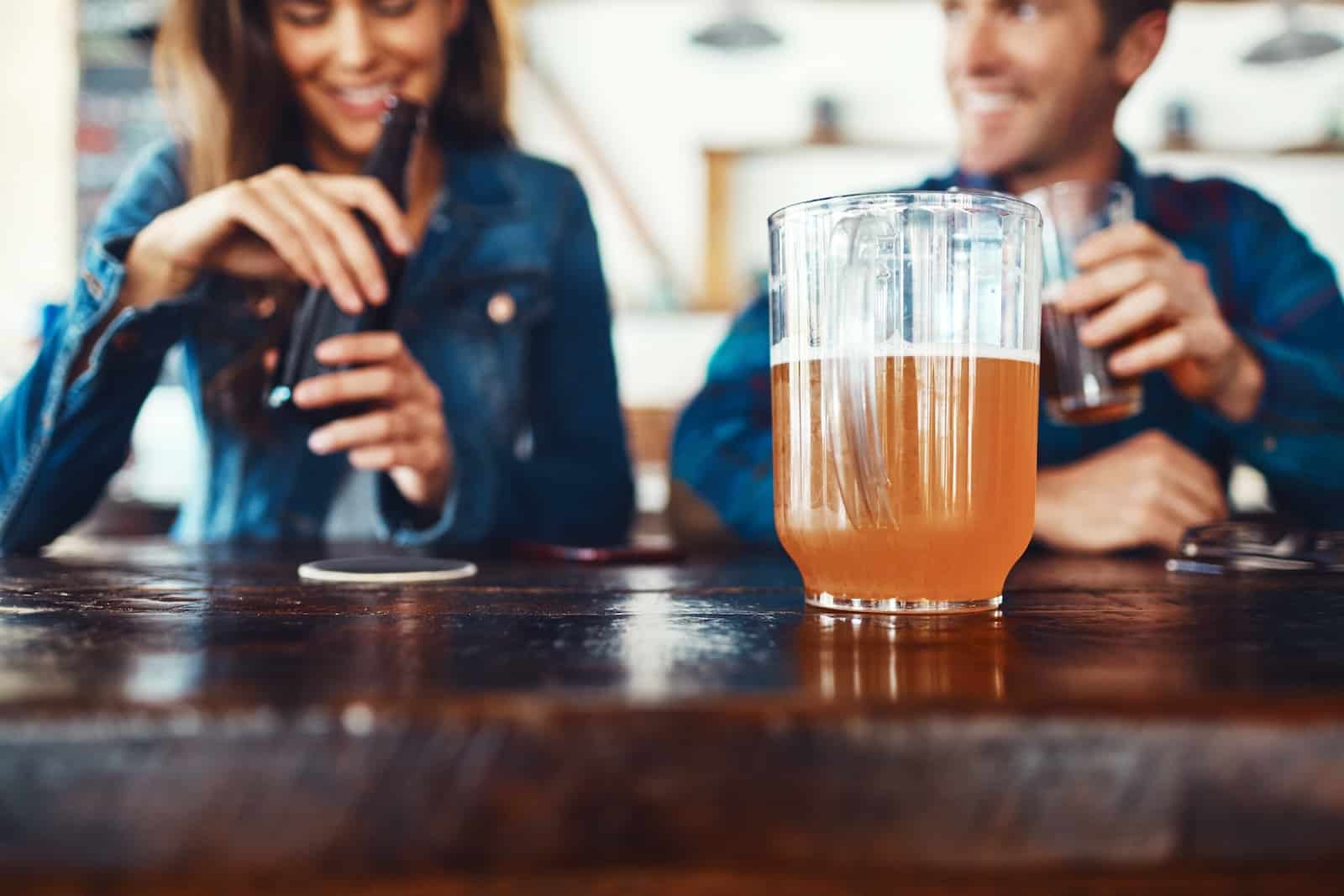 A couple at a brewery along the Mercer County Wine and Brew Trail enjoying a beer