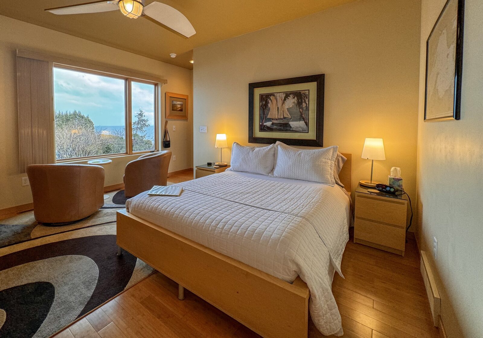 Relax in the Park Point Suite with comfy leather chairs in the picture window overlooking Lake Superior.