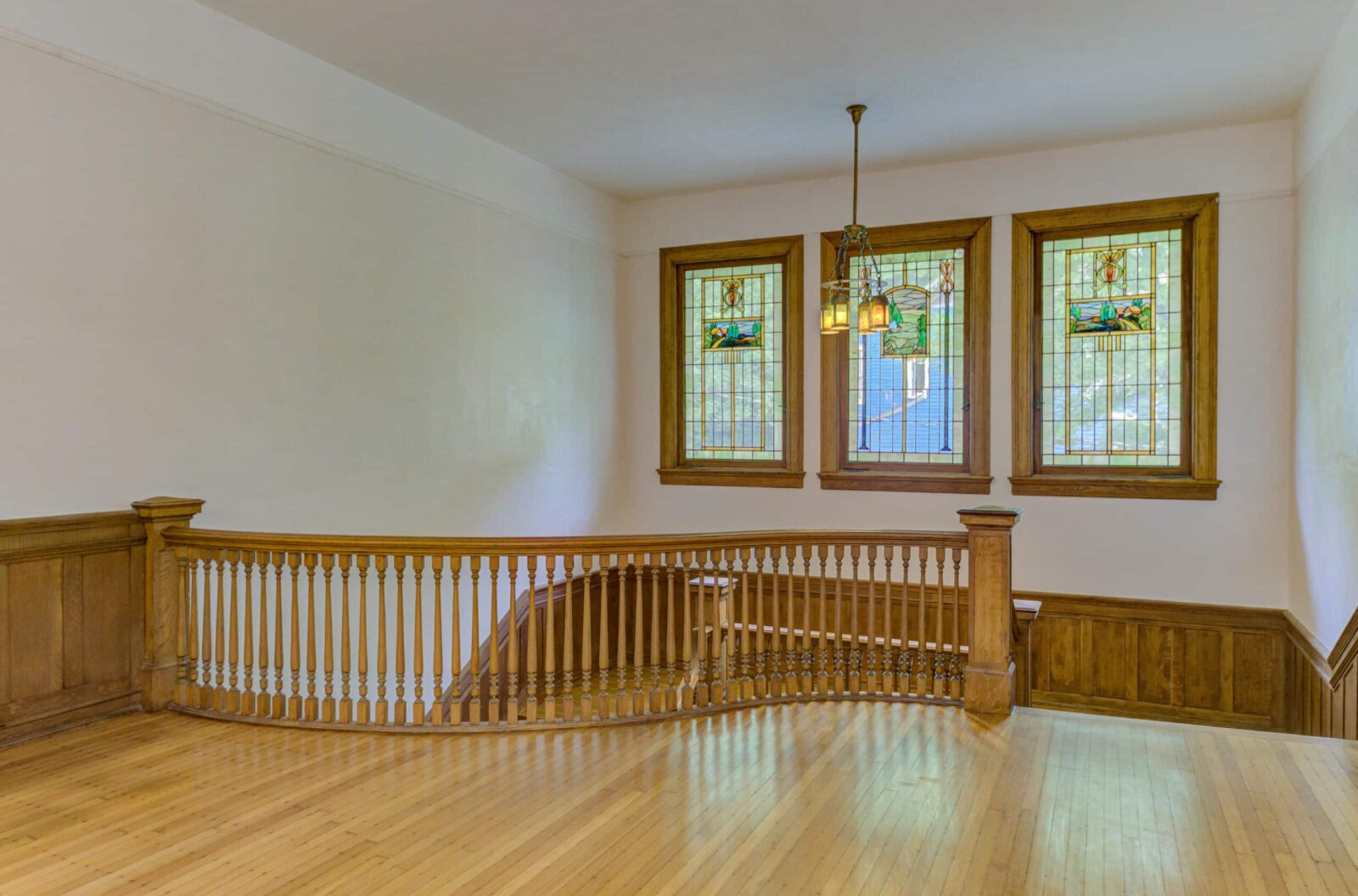 Three of the original stained glass windows from the landing at Oak Hall Mansion.