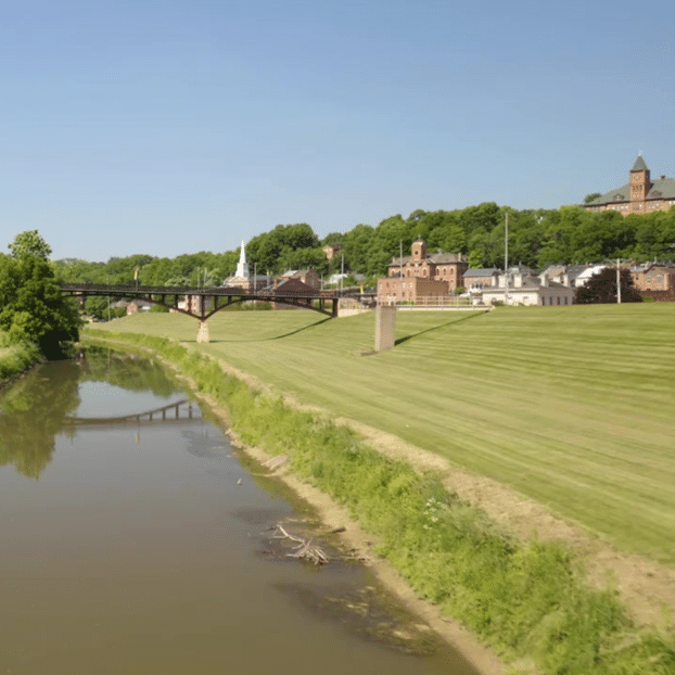 Galena River and pedestrian bridge leading into historic downtown Galena, Illinois, a top destination for romantic bed and breakfast getaways in the Midwest.