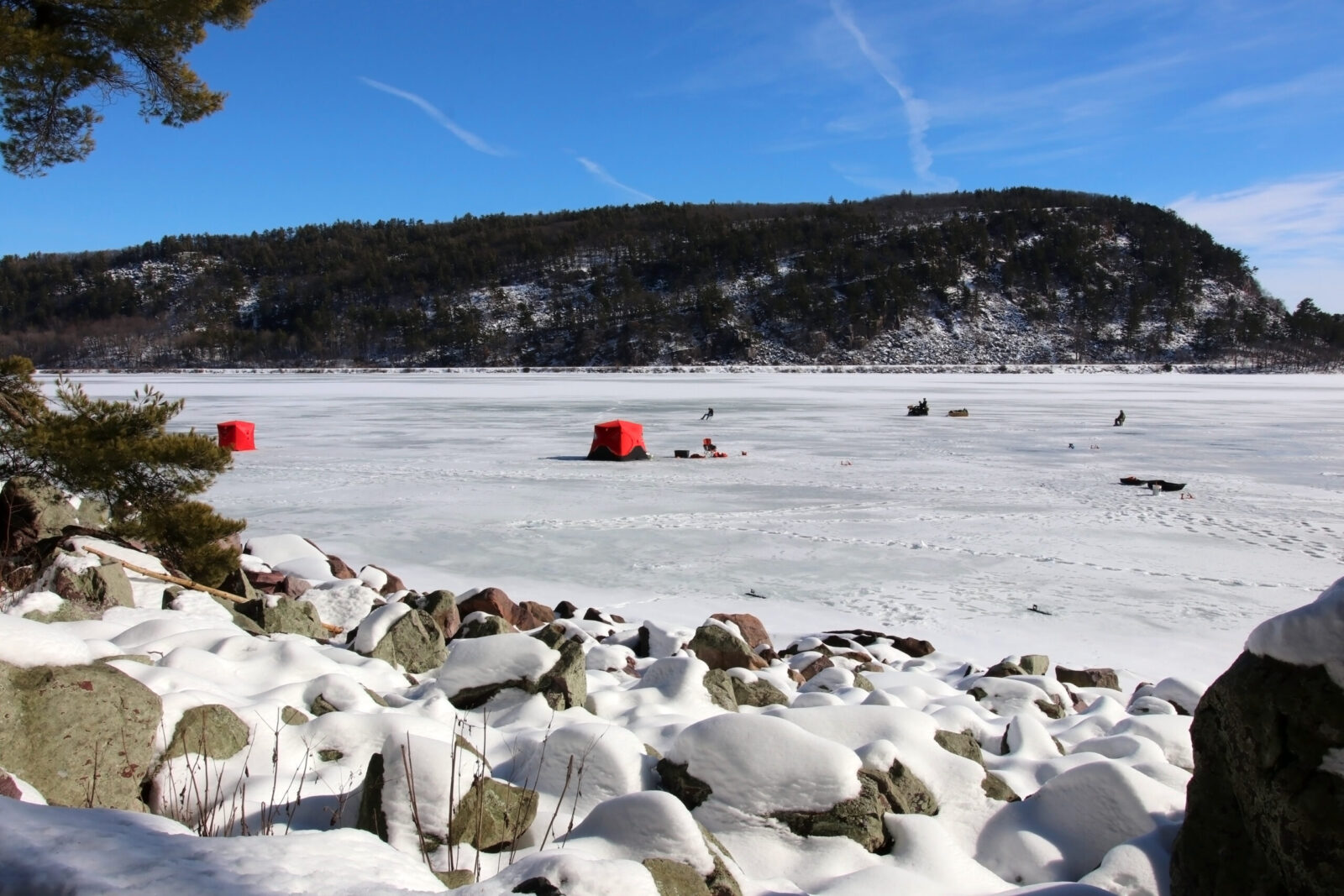 Red Tents on the frozen lake set up for ice fishing in Devils Lake State Park.