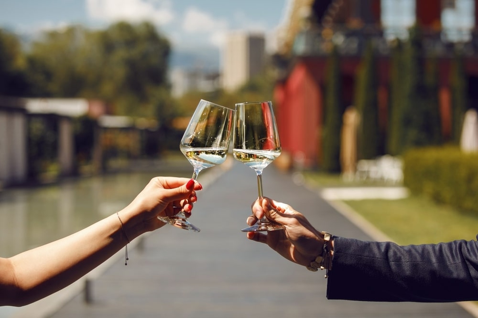 couple drinking wine glasses during their cozy fall getaway