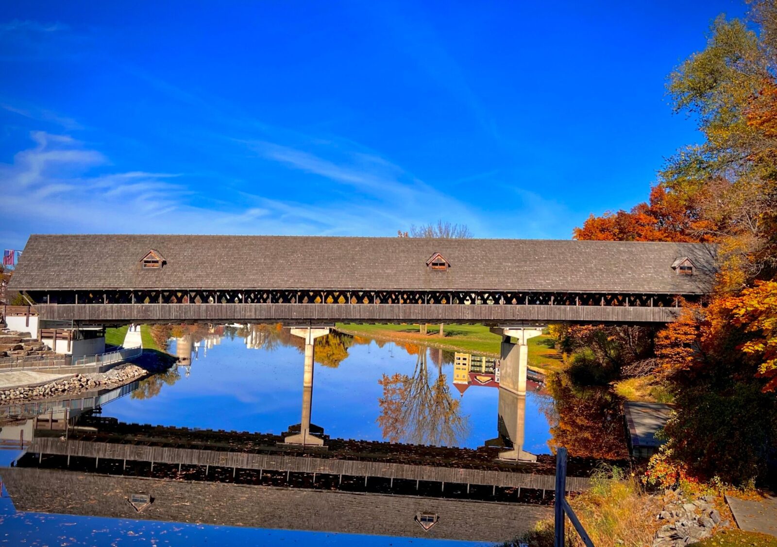 Fall Bridge over Cass River in Frankenmuth, fall foliage. Things to do in Michigan in the fall.