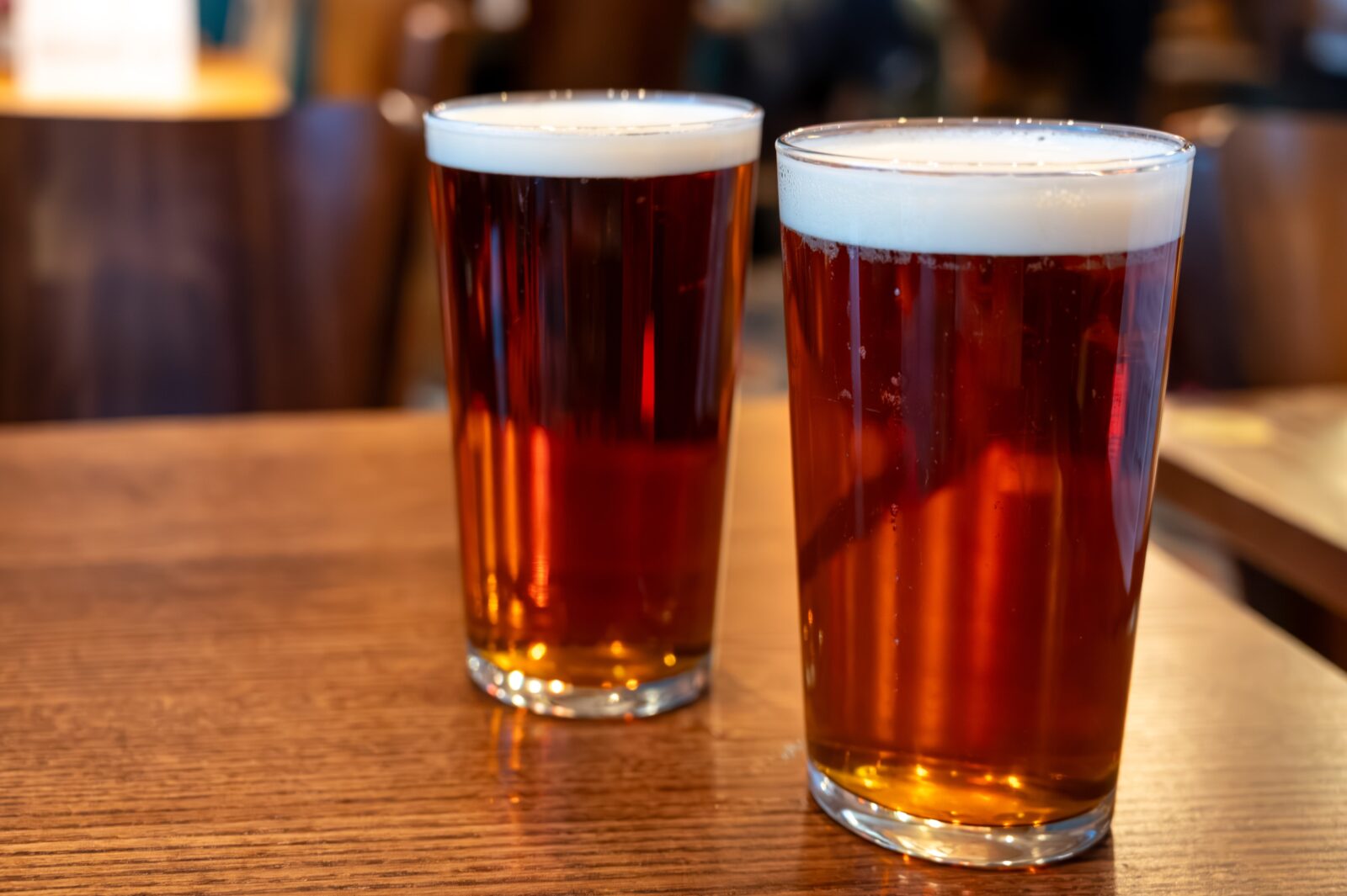 Two Glasses of Ale sit on table at Canal Park Brewing Company.