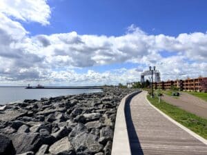 Canal Park Lakewalk along Lake Superior, aerial lift bridge in the distance. Many of the Duluth breweries on this list can be accessed from the LakeWalk