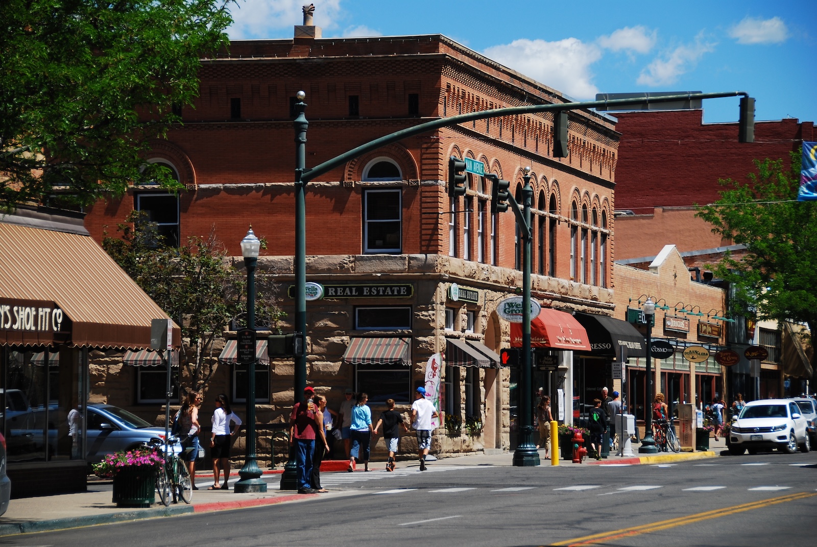 Historic brick buildings and people walking in downtown Durango, one of the things to do in Durango Colorado.