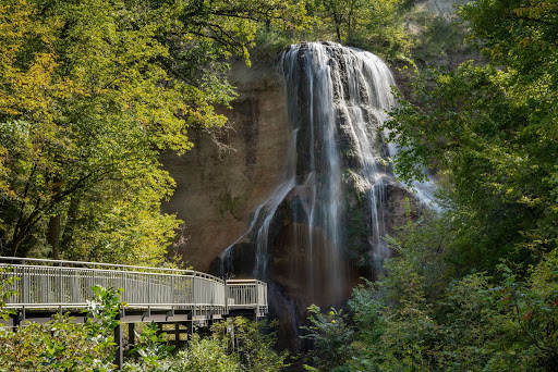 Water cascading down the rock face into the forested canyon at Smith Falls State Park in Nebraska.