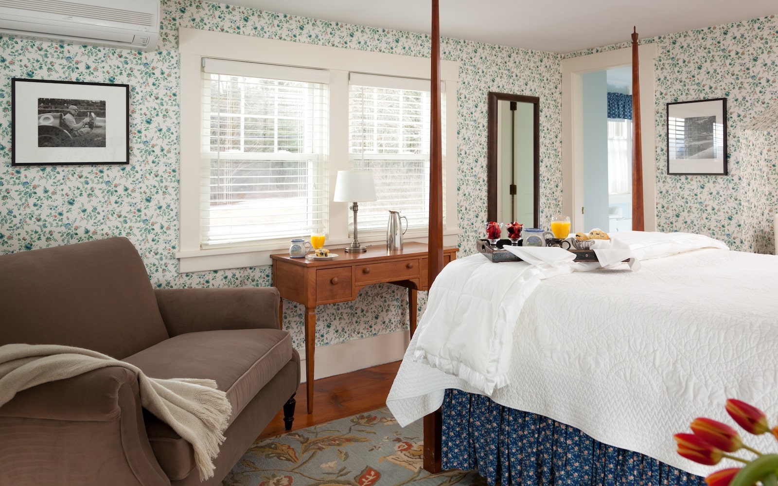 A bed and a seating area at a New Hampshire Bed and Breakfast.